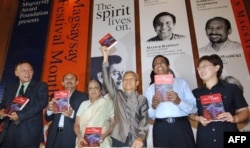 FILE - Awardees of the 2005 Ramon Magsaysay Award Foundation (L-R) Jon Ungphakorn of Thailand, Teten Masduki of Indonesia, V.Shanta of India, Sombath Somphone of Laos, Matiur Rahman of Bangladesh, and Yoon Hye-ran of South Korea, are seen in Ramon Magsaysay hall in Manila, Philippines, Aug. 29, 2005.