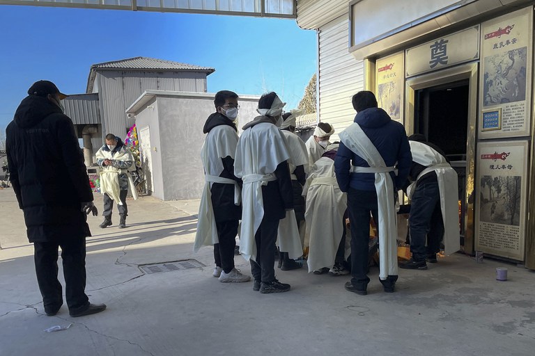 ENG_CHN_COVIDInfections_12222022.4.jpg Family members burn paper offerings for their deceased relative at Gaobeidian Funeral Home in northern China's Hebei province, Thursday, Dec. 22, 2022. Credit: Associated Press