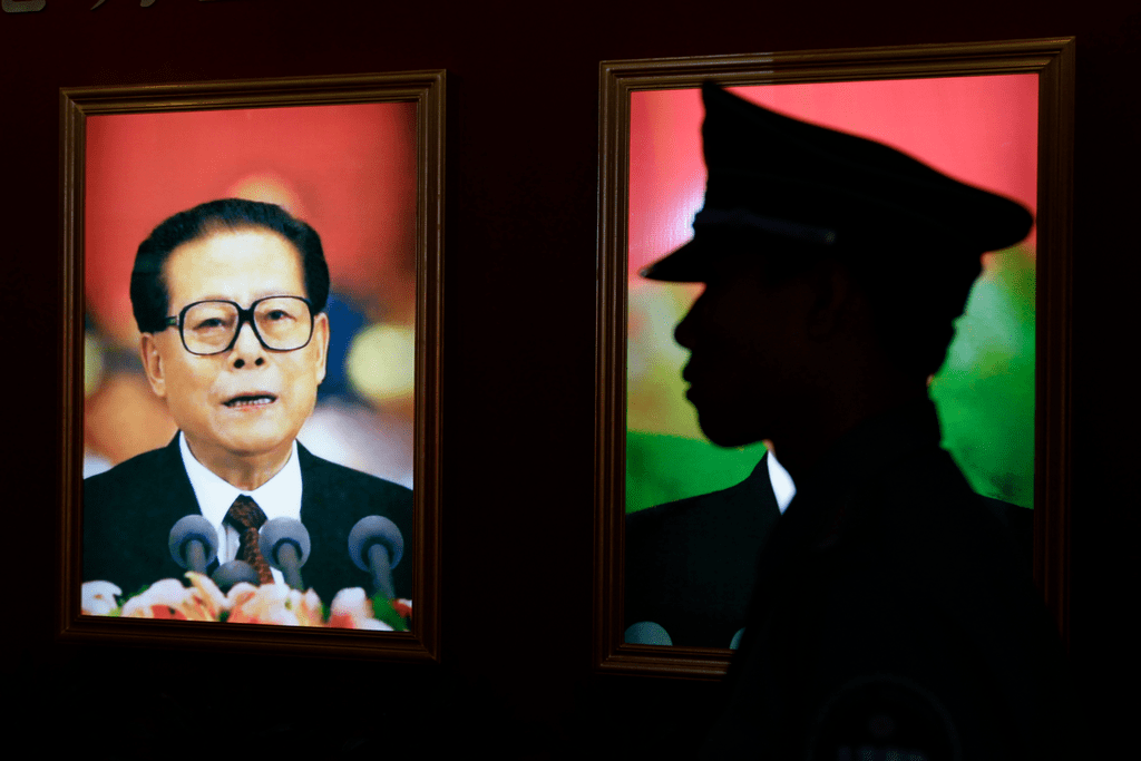 JZM_recollections_001.png A security guard stands next to a portrait of China's former President Jiang Zemin at an exhibition to celebrate the 90th anniversary of the founding of the Communist Party of China (CPC) in Beijing July 7, 2011. Credit: Reuters
