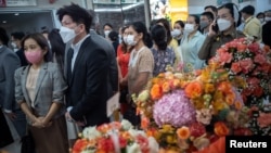 Well-wishers queue for signing a book for Thailand’s Princess Bajrakitiyabha as she has been hospitalized due to a heart problem at Chulalongkorn hospital in Bangkok, Thailand, Dec. 16, 2022.