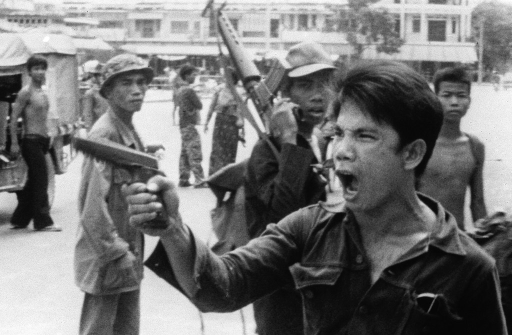 ENG_KHM_THAYER_Q&A_01072023.4.jpg A Khmer Rouge soldier waves his pistol and orders store owners to abandon their shops in Phnom Penh, Cambodia, on April 17, 1975, as the capital falls to the communist forces. Credit: Associated Press
