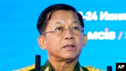 FILE - Commander-in-Chief of Myanmar's armed forces, Senior Gen. Min Aung Hlaing delivers his speech at the IX Moscow conference on international security in Moscow, Russia, June 23, 2021.