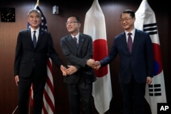 FILE - U.S. Special Representative for N. Korea Sung Kim, left, Japan Director-General for Asian and Oceanian Affairs Bureau Takehiro Funakoshi, center, and S. Korea Special Rep. for Korean Peninsula Peace & Security Affairs Kim Gunn at the Ministry of Foreign A