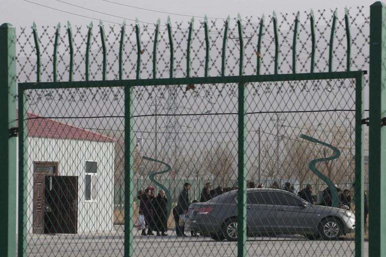 ENG_____HumanRightsReport_03202023-02.jpg In this Dec. 3, 2018 photo, residents line up inside the Artux City Vocational Skills Education Training Service Center which has previously been revealed by leaked documents to be a forced indoctrination camp at the Kunshan Industrial Park in Artux in western China's Xinjiang region. (Ng Han Guan/AP)