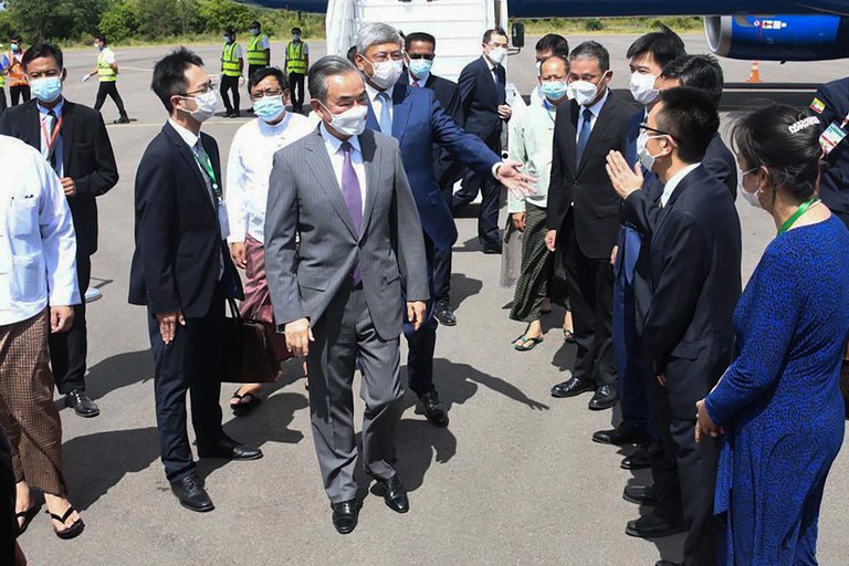 ENG_BUR_ChinaInterference_04282023_03.jpg In this handout photo Chinese foreign minister Wang Yi, center is welcomed at Myanmar's Nyaung-U Airport to attend a foreign ministers' meeting of the Lancang-Mekong Cooperation mechanism on July 2, 2022 Credit: Myanmar Military/AFP