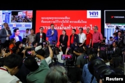 Leaders of the Pheu Thai Party speak to the media after the polling stations closed on the day of the general elections in Bangkok, Thailand, May 14, 2023.