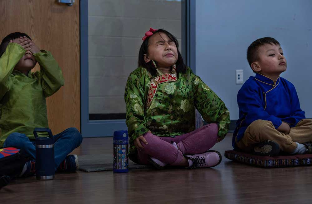 20230507-Tibetan-School-_03.jpg Children dressed in traditional Tibetan clothes try to concentrate as they learn how to meditate at weekly Tibetan language school in Vienna Community Center in northern Virginia, Sunday, May 7, 2023. Credit: Gemunu Amarasinghe/RFA