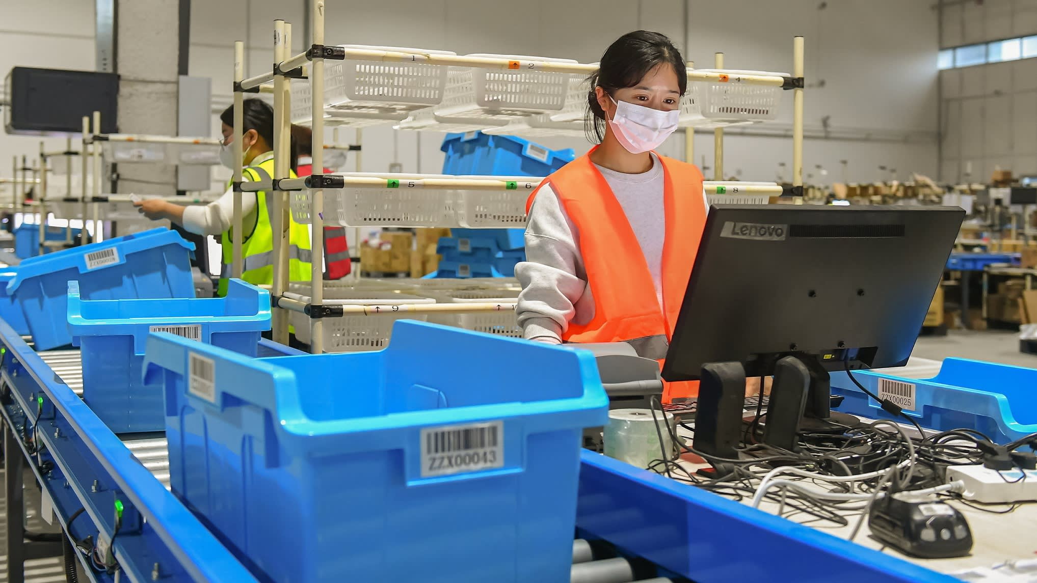 Staff at a warehouse of Alibaba’s Cainiao in China