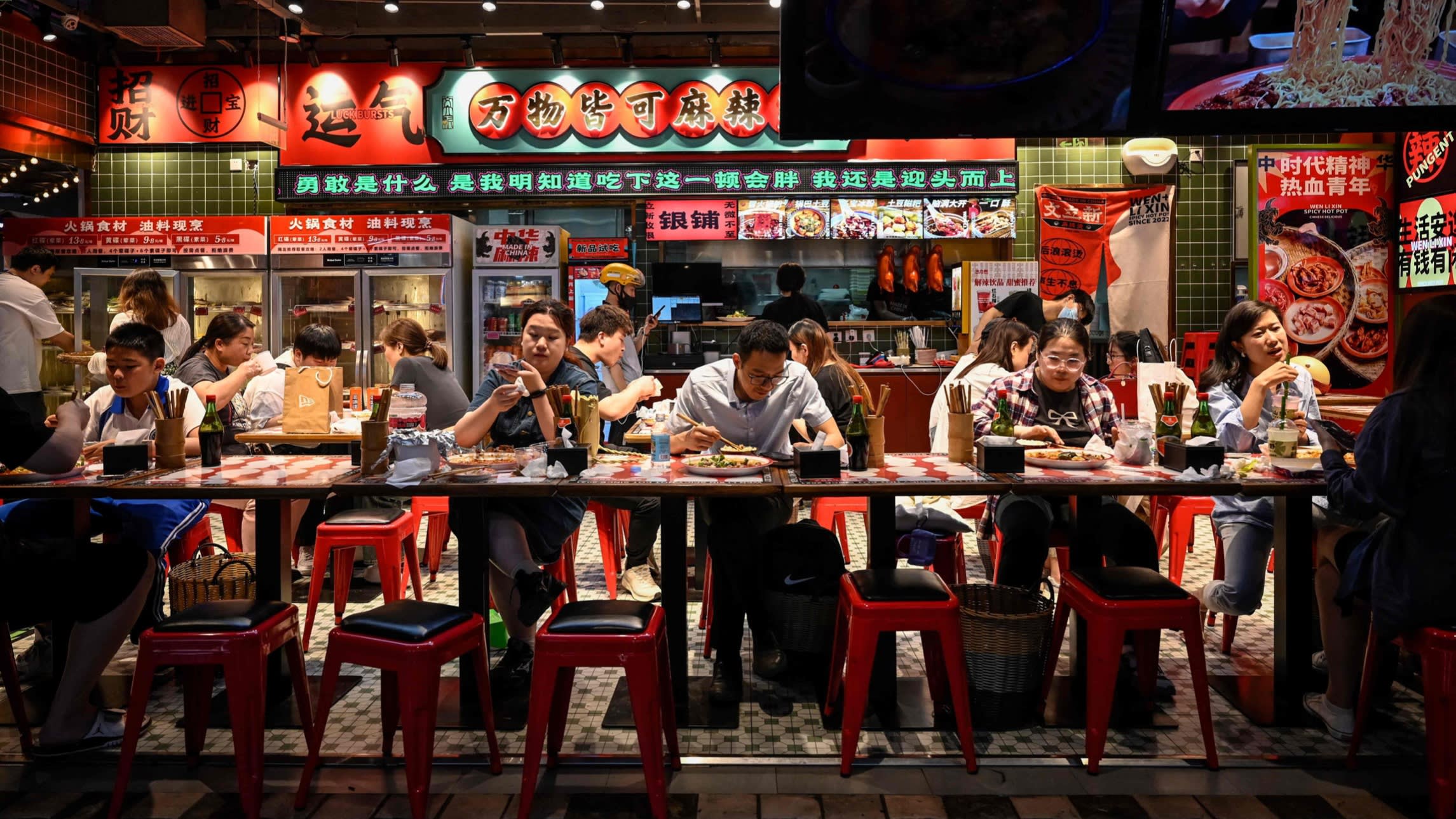 People dine in a Beijing restaurant in May