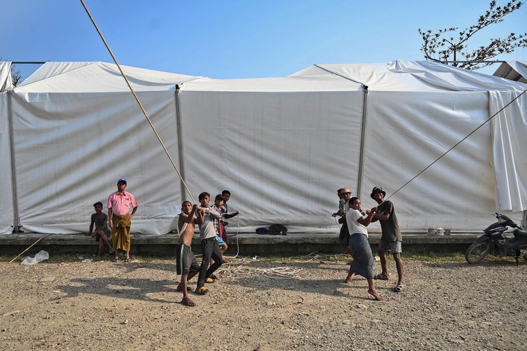 ENG_BUR_AidRakhine_06082023_03A.jpg Workers rebuild a damaged UN World Food Program warehouse in Sittwe in the aftermath of Cyclone Mocha's landfall. Credit: Sai Aung Main/AFP