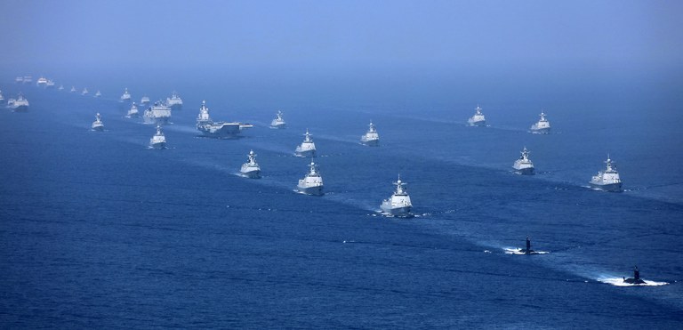 ENG_VTN_BARBIE_07052023_04.jpg The Liaoning aircraft carrier is accompanied by navy frigates and submarines conducting an exercise in the South China Sea in 2018. Credit: Li Gang/Xinhua via AP