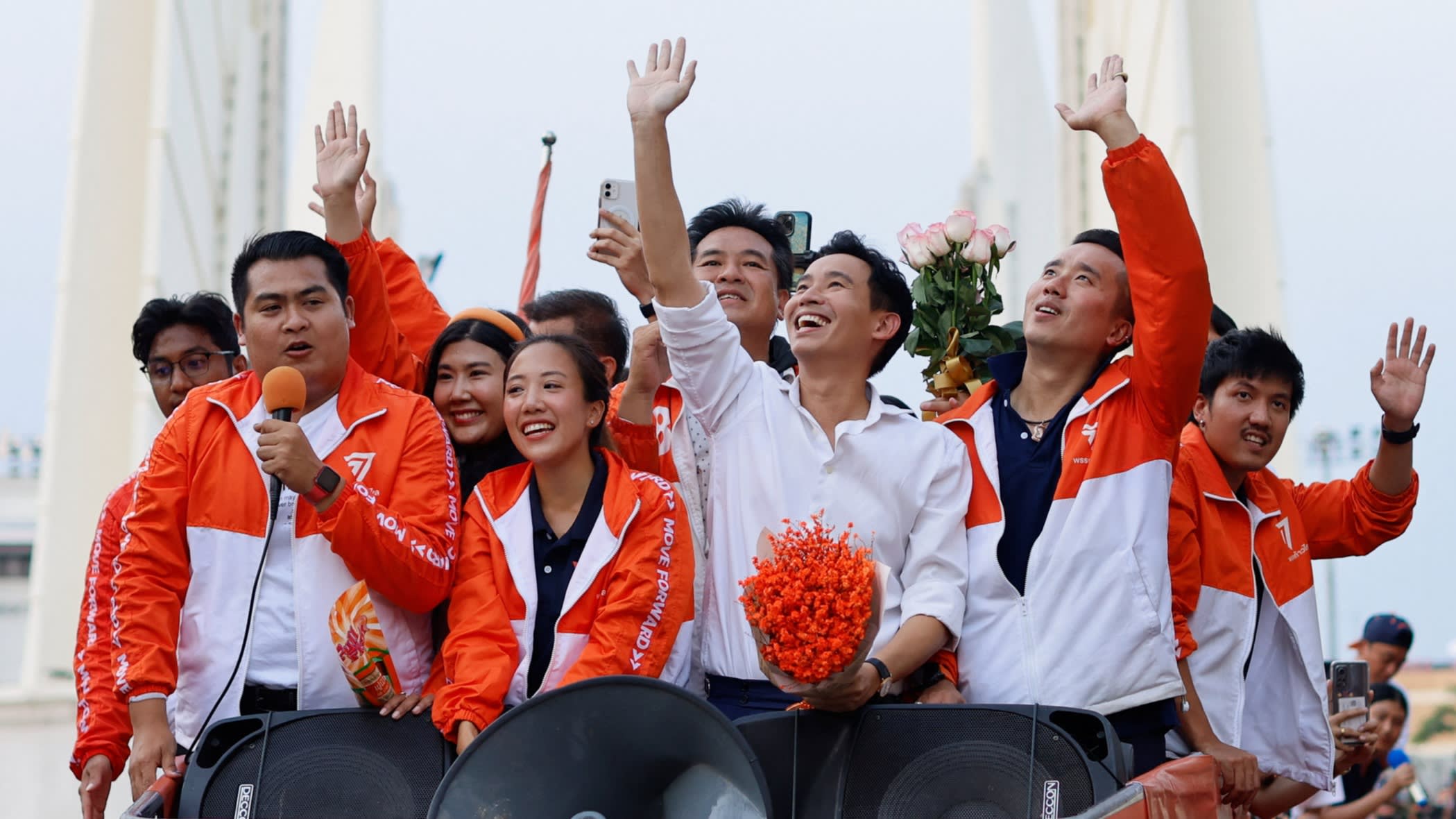 Pita with party members on top of an election vehicle