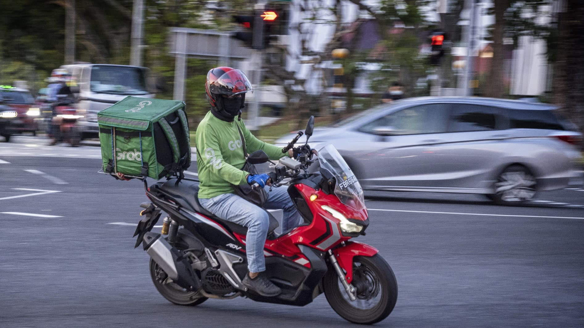 A GrabFood delivery rider on the road in Singapore