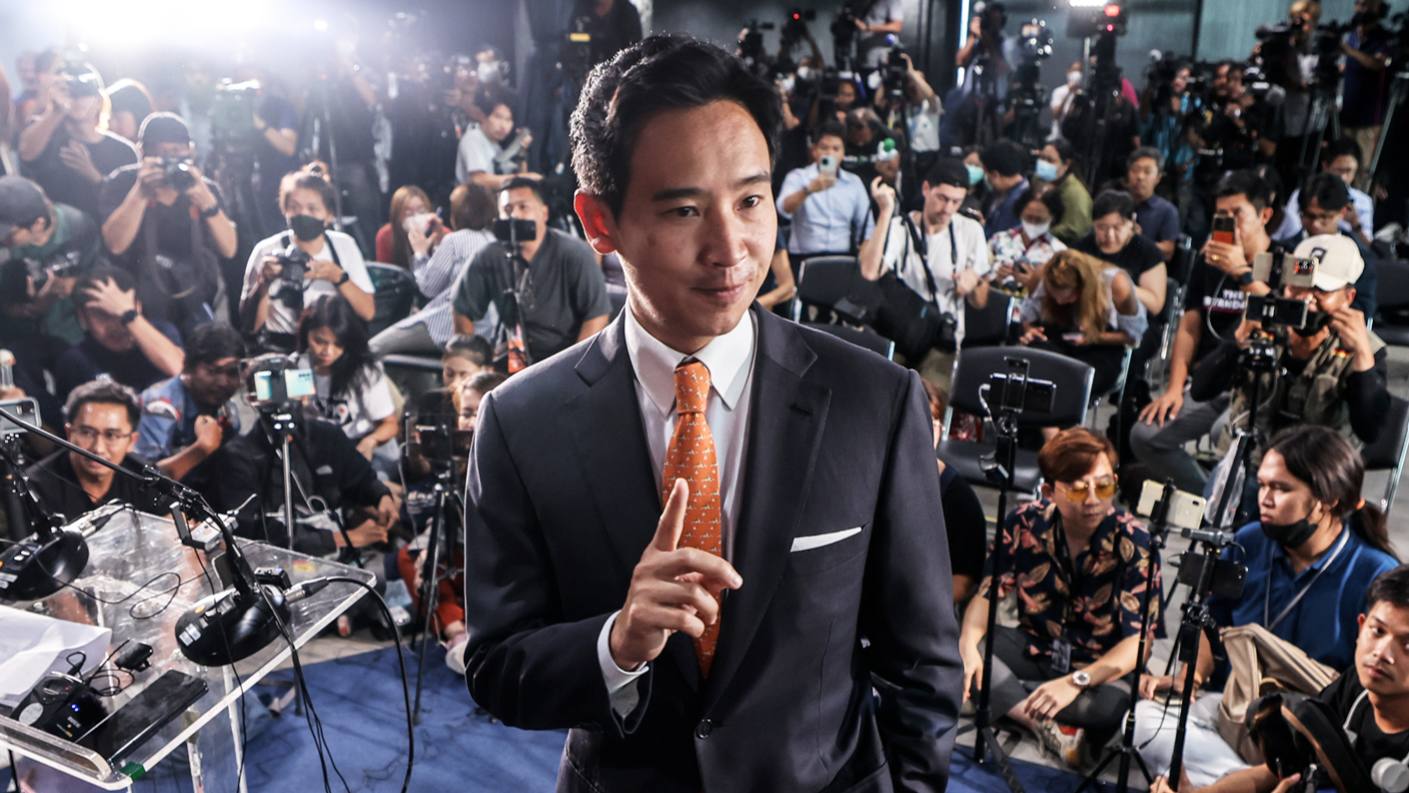 Move Forward Party leader Pita Limjaroenrat holds a ‘No. 1’ victory pose at a news conference in Bangkok