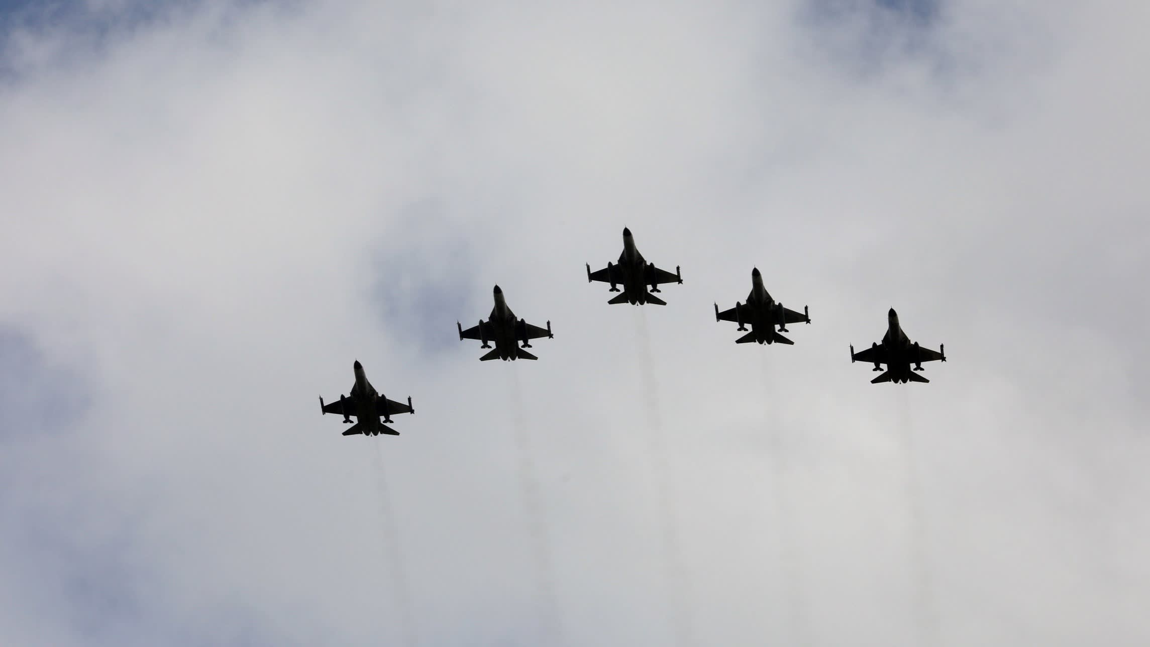 Taiwanese F-16 fighter jets fly in formation during a ceremony in Taichung, Taiwan