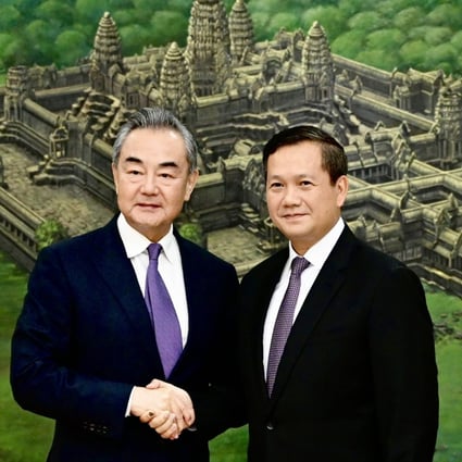 Hun Manet, designated as Cambodia new prime minister, right, shakes hands with Chinese Foreign Minister Wang Yi , during a meeting at the Peace Palace in Phnom Penh, Cambodia on Sunday, August 13, 2023. Wang Yi is on an official visit in Cambodia to tighten ties and cooperation between the two countries. Photo: EPA-EFE