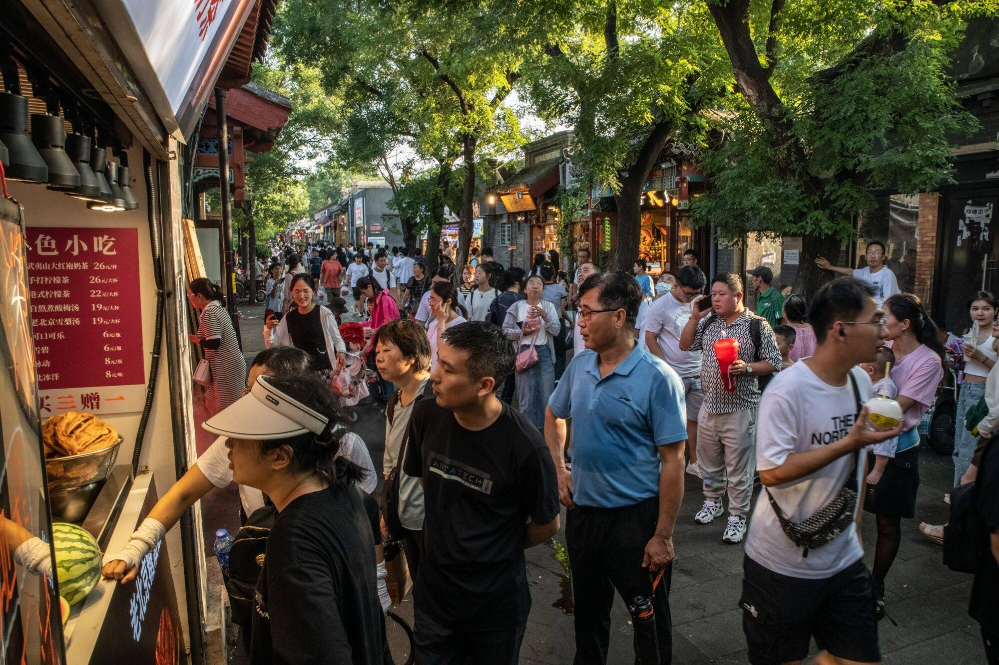 Visitors at Nanluoguxiang, a tourist hot spot in Beijing. Photo: Bloomberg