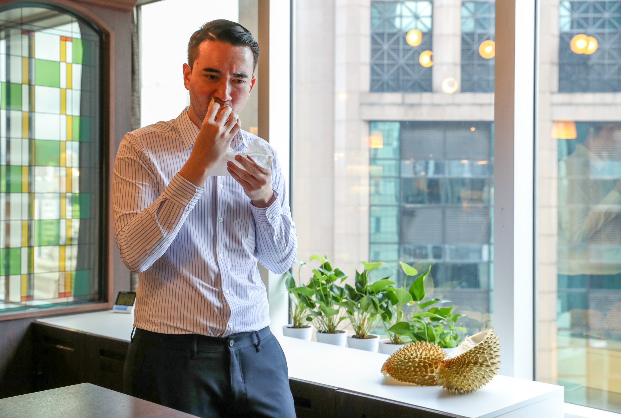 Shea Driscoll, the Post’s digital editor, is unimpressed with China’s first home-grown durian. Photo: Sun Yeung