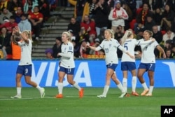 England's Lauren James, right, celebrates with teammate after she scored during the Women's World Cup Group D soccer match between China and England in Adelaide, Australia, on Aug. 1, 2023.