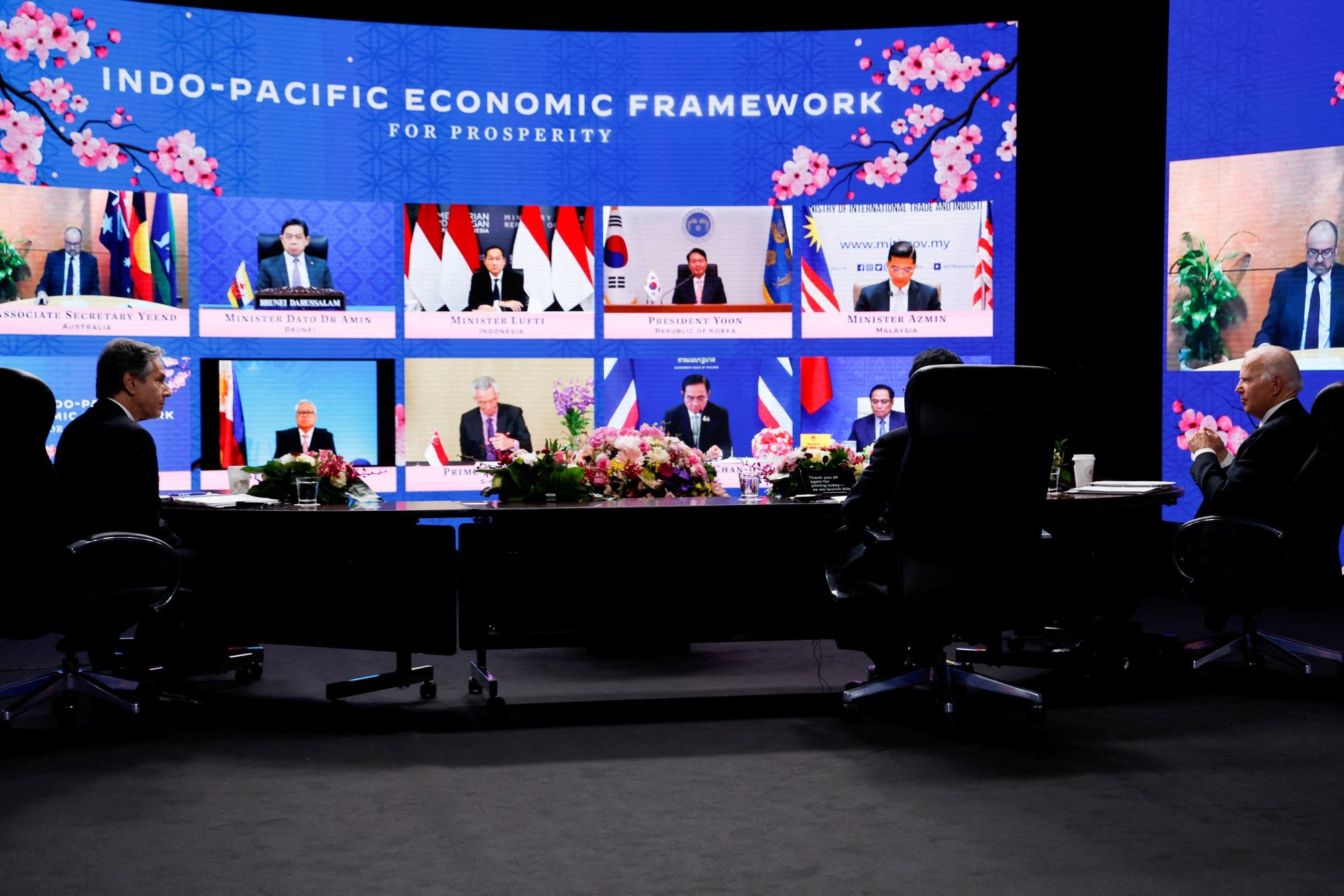 President Joe Biden (right), Secretary of State Antony Blinken (left) and Japanese Prime Minister Fumio Kishida (back to the camera) listen to other leaders joining the Indo-Pacific Economic Framework for Prosperity launch event, in Tokyo on May 23, 2022. Photo: Reuters