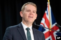New Zealand's Prime Minister Chris Hipkins announces an end to all COVID-19 restrictions during a press conference at the Parliament in Wellington, Aug. 14, 2023.