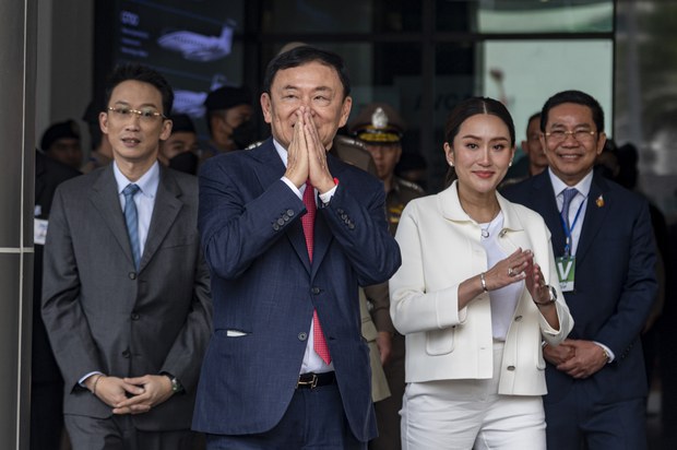 thai2.jpg Former premier Thaksin Shinawatra, alongside his son, Panthongtae, and daughter, Paetongtarn, greets supporters after arriving at Mjets private terminal at Don Mueang International Airport in Bangkok, Aug. 22, 2023. Credit: Thai News Pix/BenarNews