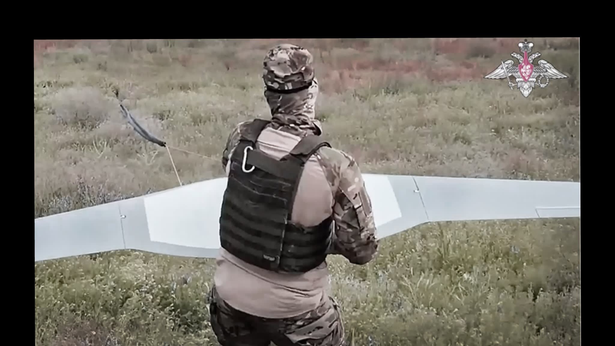 A still showing a soldier launching reconnaissance drones