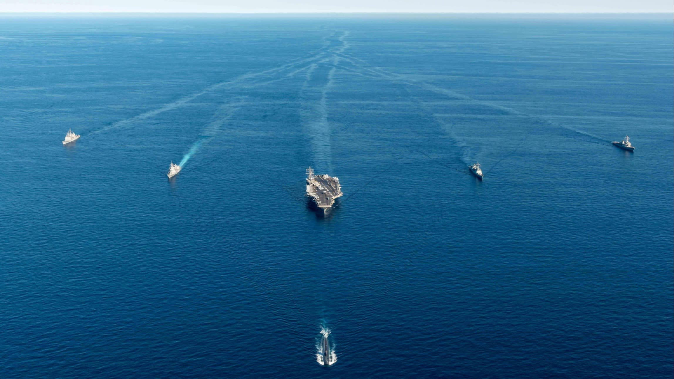 US, Japanese and South Korean naval vsesels participate in a trilateral anti-submarine exercise in the international waters off the Korean Peninsula last year