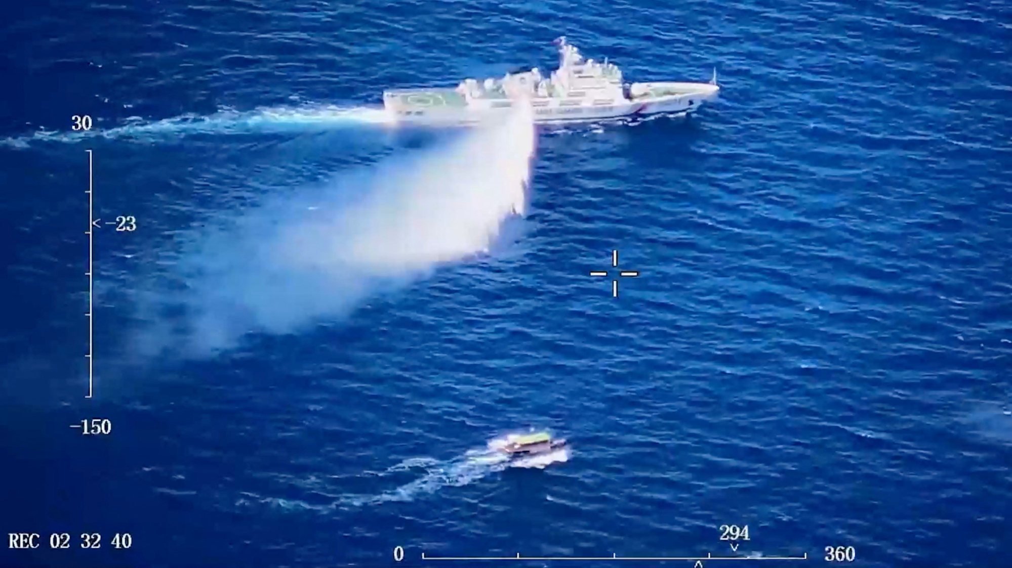 A Chinese Coast Guard ship launches what it says is a warning water cannon spray in the direction of a Philippine vessel as seen in a screen grab from a video released on August 8. Photo: China Coast Guard