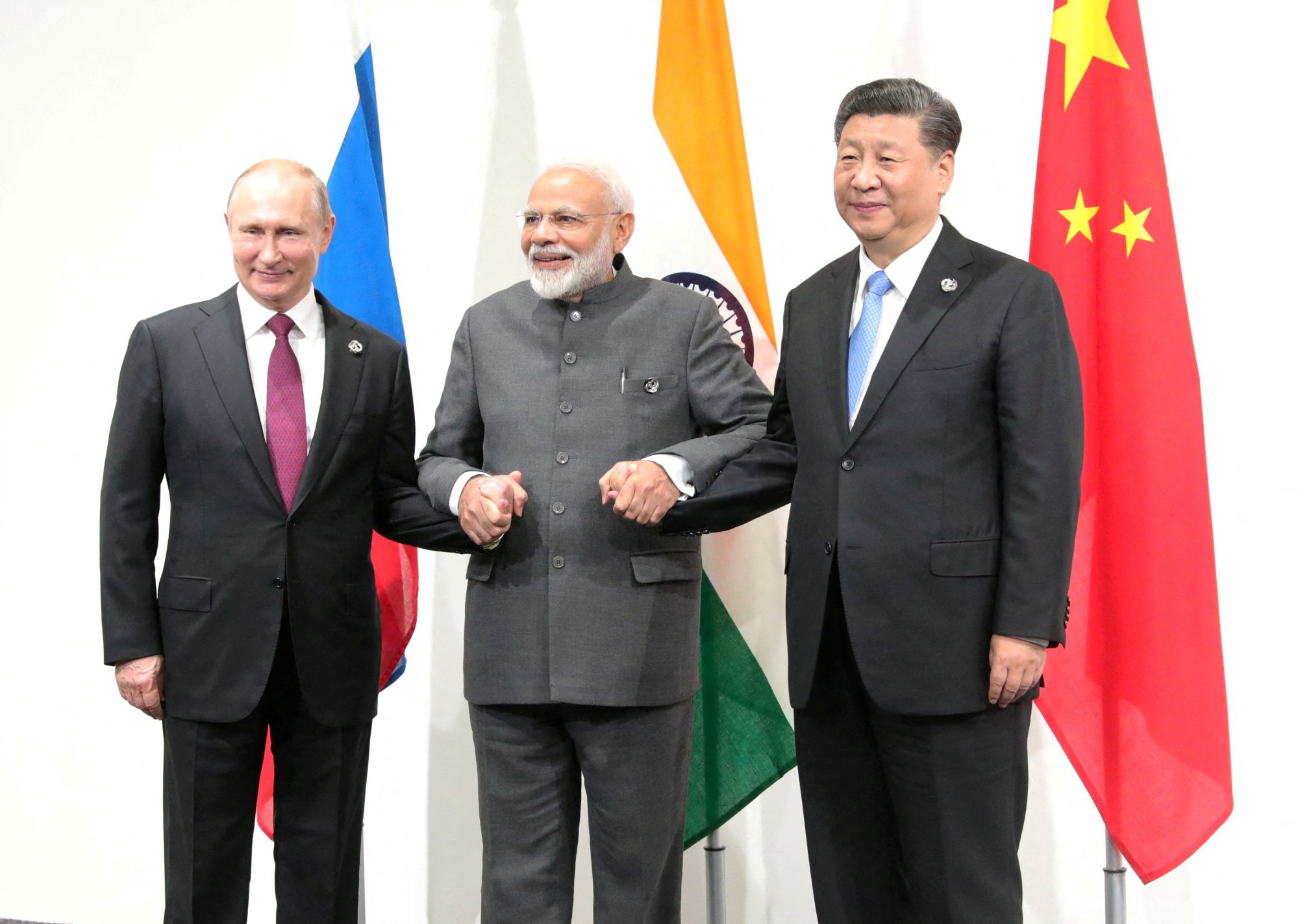 Modi flanked by Russian President Vladimir Putin and Chinese President Xi Jinping during a G20 meeting in Japan in 2019. Both Putin and Xi have chosen not to attend this year’s session. Photo: Sputnik/Kremlin via Reuters
