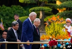 U.S. President Joe Biden participates in a welcome ceremony hosted by Vietnam's Communist Party General Secretary Nguyen Phu Trong at the Presidential Palace in Hanoi, Sept. 10, 2023.