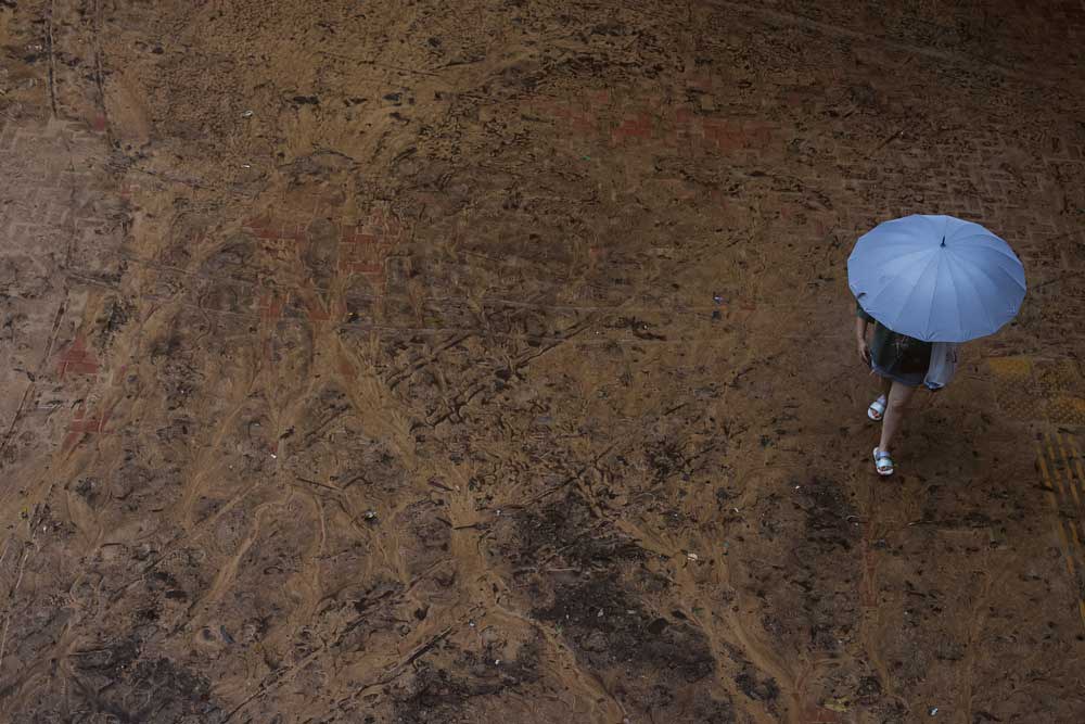 Embed-2-_ASIA-WEATHER-HONGKONG-FLOOD.jpg A person walks through mud in the aftermath of flooding and heavy rain in Hong Kong, Friday, Sept. 8, 2023. Credit: Tyrone Siu/Reuters