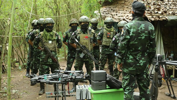 ENG_BUR_DRONEWAR_09262023.3.jpg Members of the anti-junta drone militia group Federal Wings listen to instructions from their commander in an undisclosed location in Myanmar, Sept. 4, 2023. Credit: Federal Wings