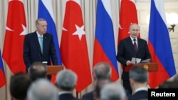 Turkish President Tayyip Erdogan, left, and his Russian counterpart Vladimir Putin speak at a press conference after their meeting in Sochi, Russia Sept. 4, 2023. (Turkish Presidential Press Office/Handout via Reuters)