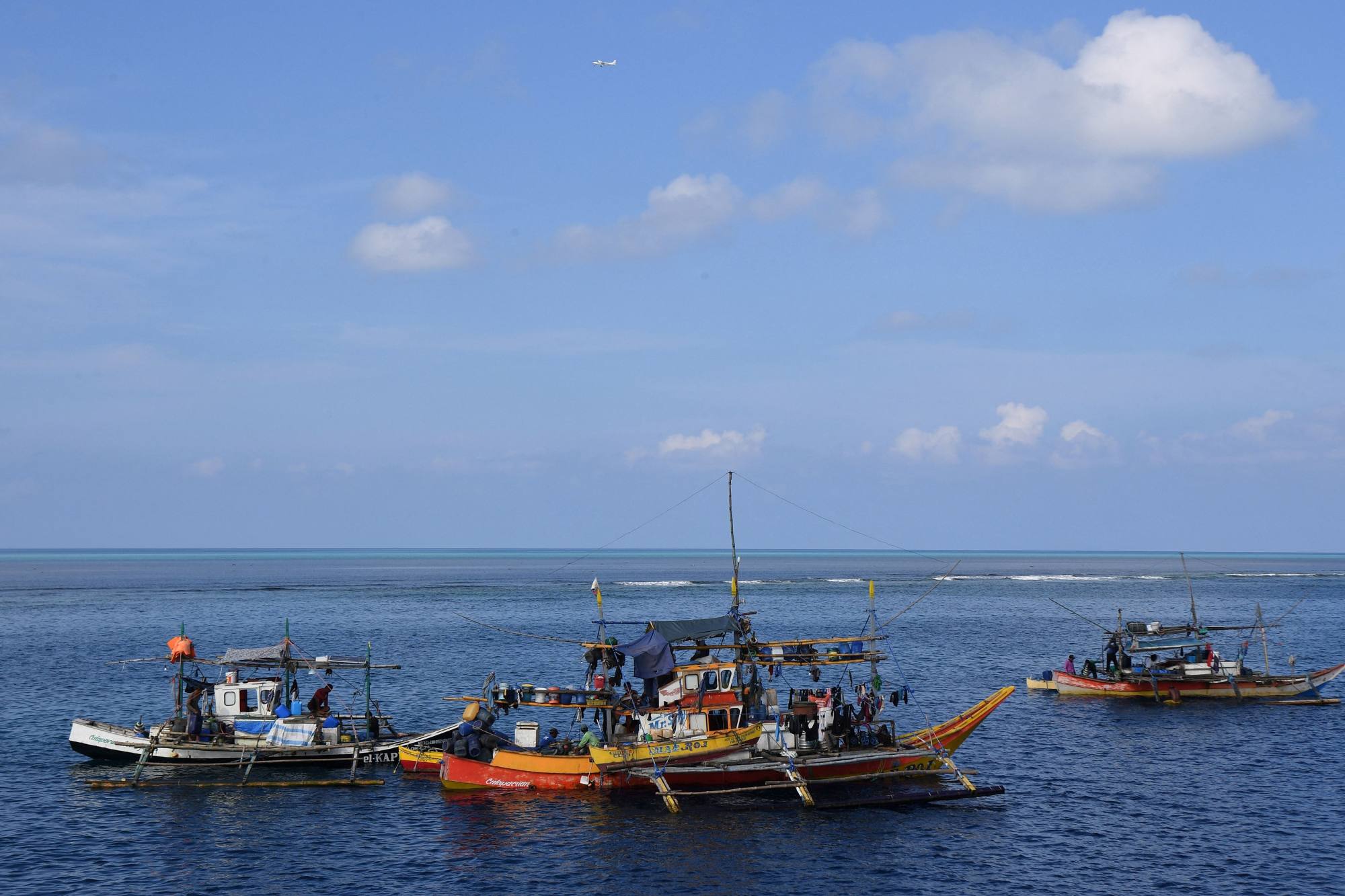 Philippine fishing boats anchored near the Chinese-controlled shoal on Thursday. Photo: AFP