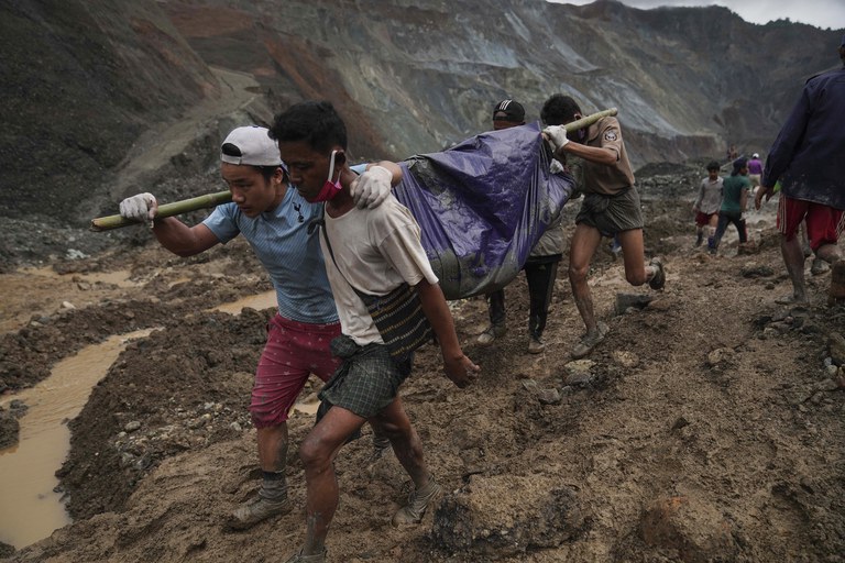 ENG_BUR_LandslideDeaths_09012023.4.jpg Rescue workers carry a body shrouded in plastic sheeting, in Hpakant, Kachin state, Myanmar, July 2, 2020, after a landslide killed more than 160 people. Credit: Zaw Moe Htet/AP