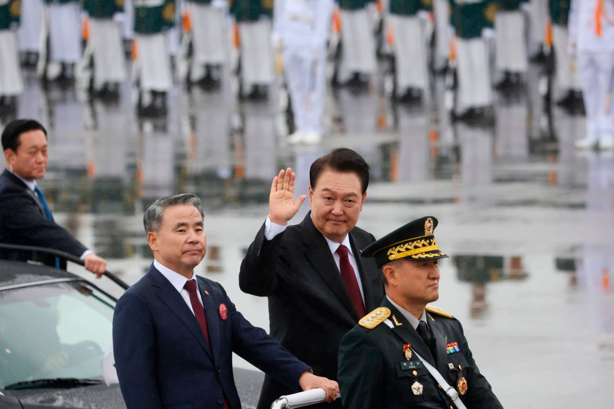 South Korea’s president Yoon Suk Yeol waves during a military parade in Seoul