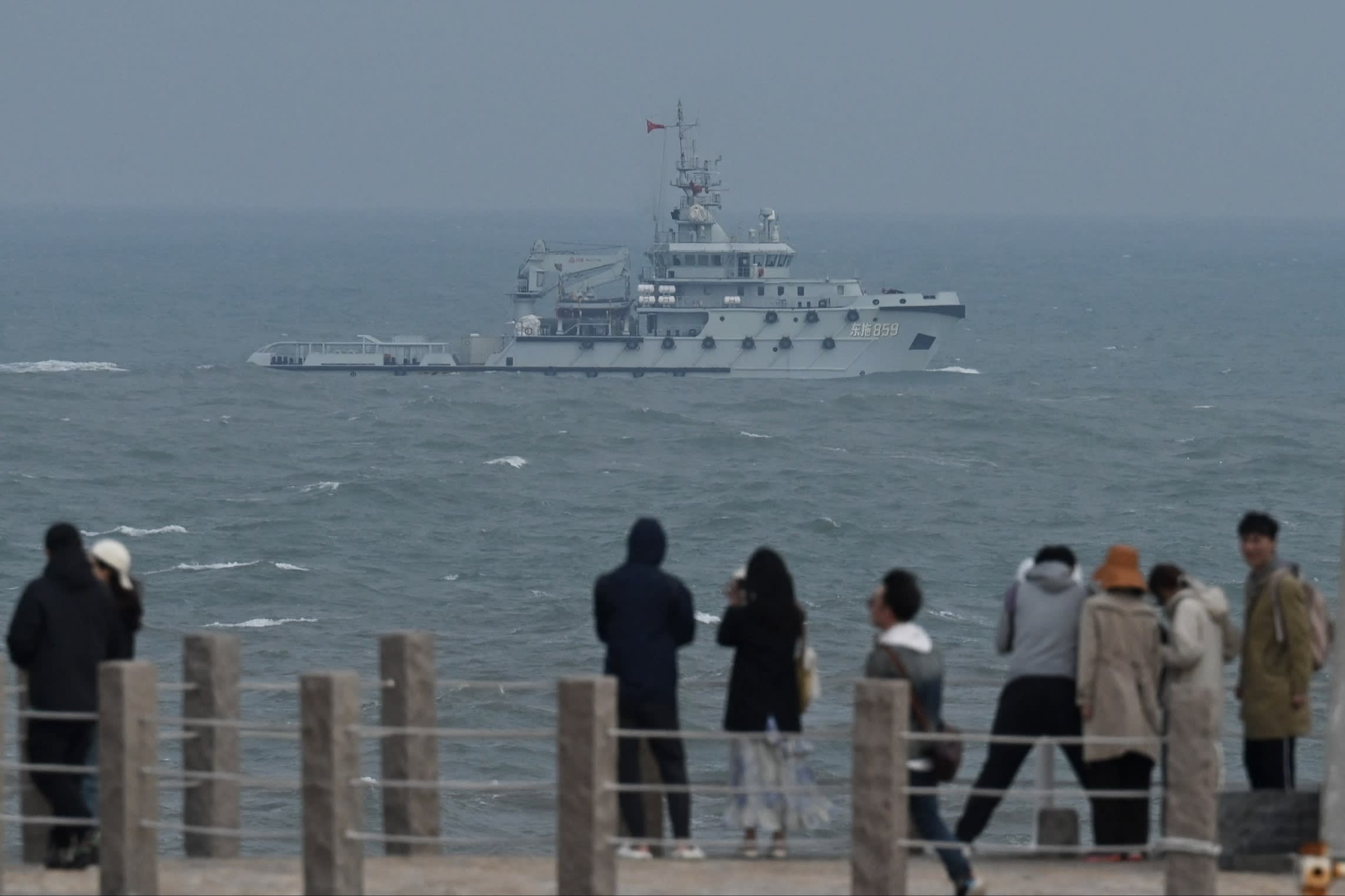 Taiwan opposition candidate to push US for clarity on defence commitments 1 A People’s Liberation Army Navy tugboat sails in the Taiwan Strait past tourists on Pingtan island in China’s Fujian province