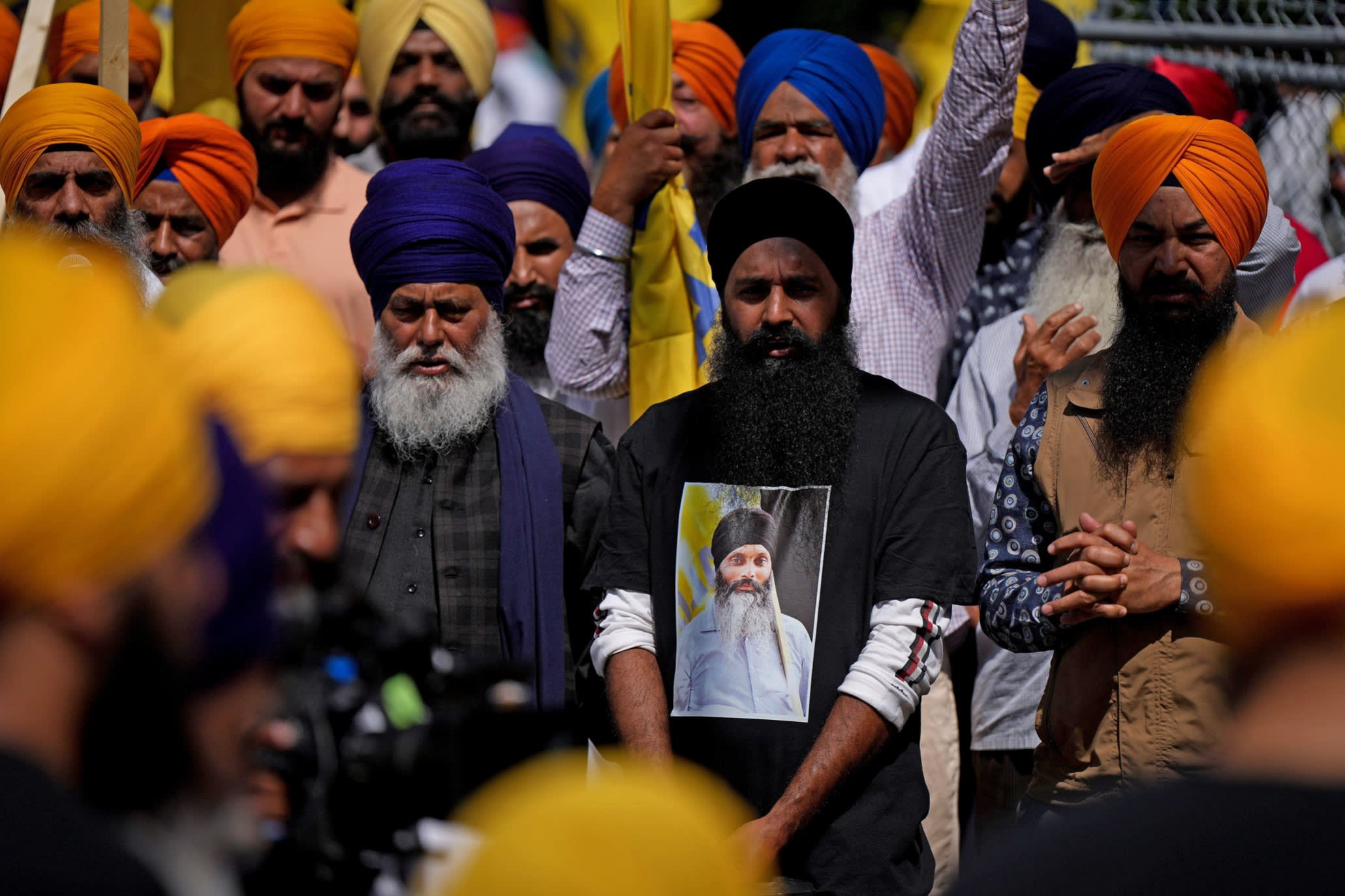 Trudeau and Modi rift deepens with tit-for-tat expulsions after murder claim 3 A mourner wears a t-shirt bearing a photograph of Hardeep Singh Nijjar