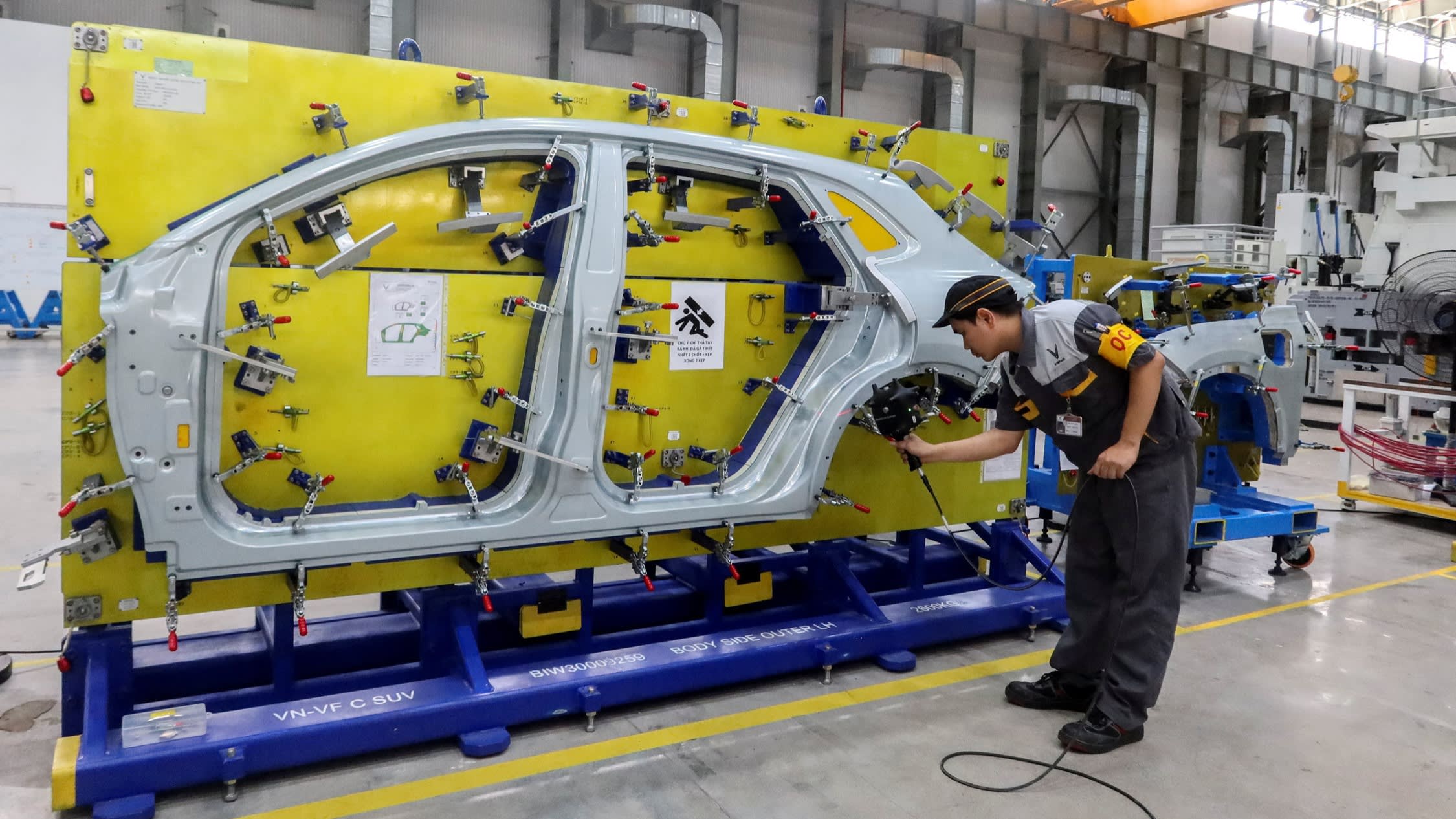 An employee works at the VinFast car factory in Haiphong, Vietnam
