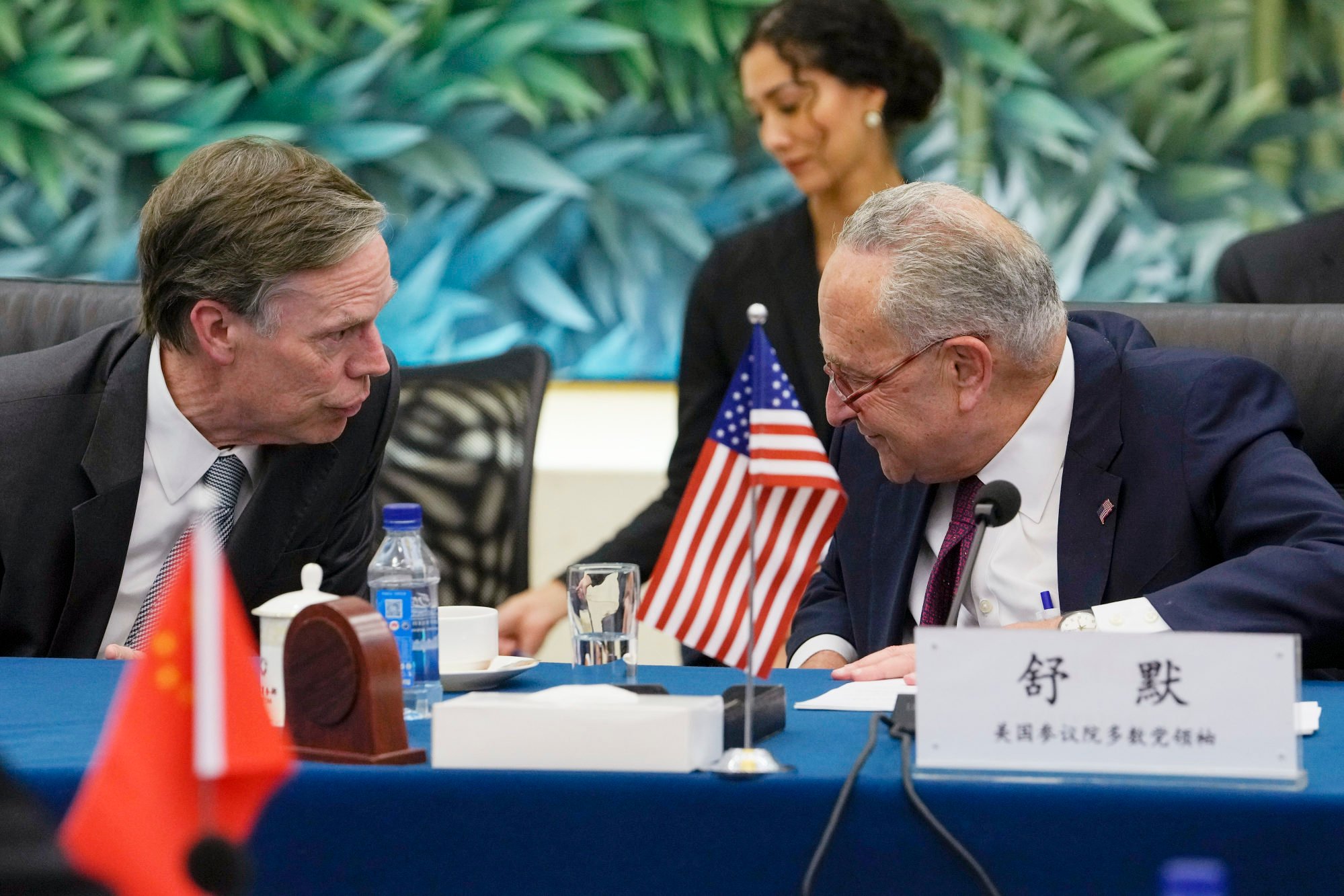 US Senate Majority Leader Chuck Schumer, right, talks to US ambassador to China Nicholas Burns during a bilateral meeting with Chinese Commerce Minister Wang Wentao, at the Ministry of Commerce in Beijing on Monday. Photo: AP Photo