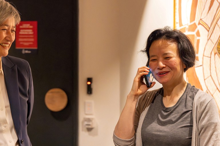 ENG_CHN_ChengLeiRelease_10112023.3.JPG Australian journalist Cheng Lei speaks on the phone on arrival at Melbourne Airport in Melbourne, Australia, on Wednesday, Oct. 11, 2023. Credit: AAP Image/Supplied by the Department of Foreign Affairs and Trade via Reuters
