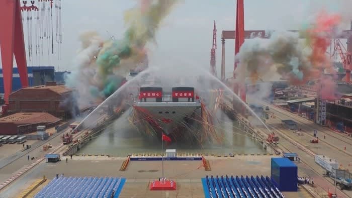 A screen grab of a video released by Chinese state broadcaster CCTV that shows the launch ceremony of the Fujian aircraft carrier in Shanghai in June