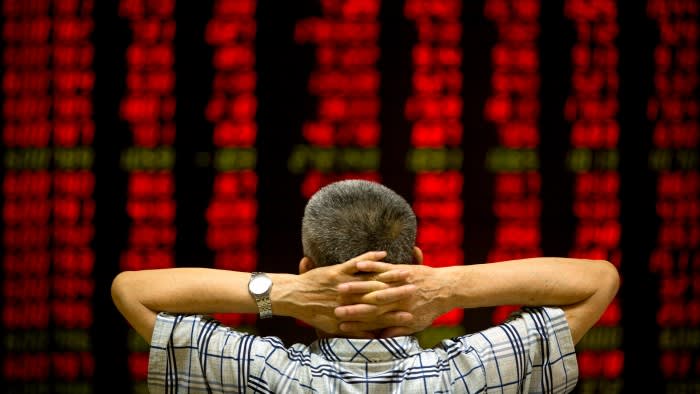 Stock price monitor at a brokerage house in Beijing