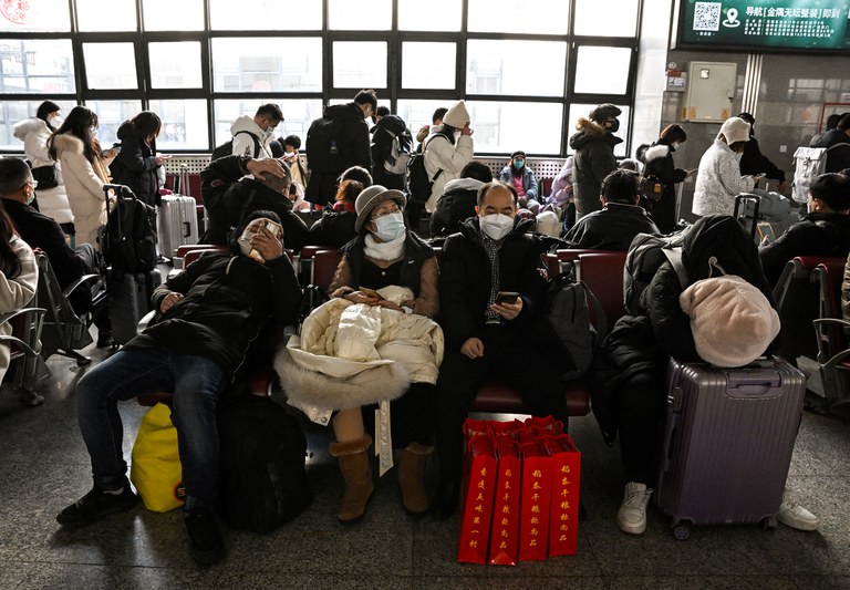 ENG_CHN_NewYearsEve_10262023.2.jpg Passengers wait for their train to arrive at Beijing West railway station ahead of the Lunar New Year in Beijing on Jan. 21, 2023. Credit: Noel Celis/AFP