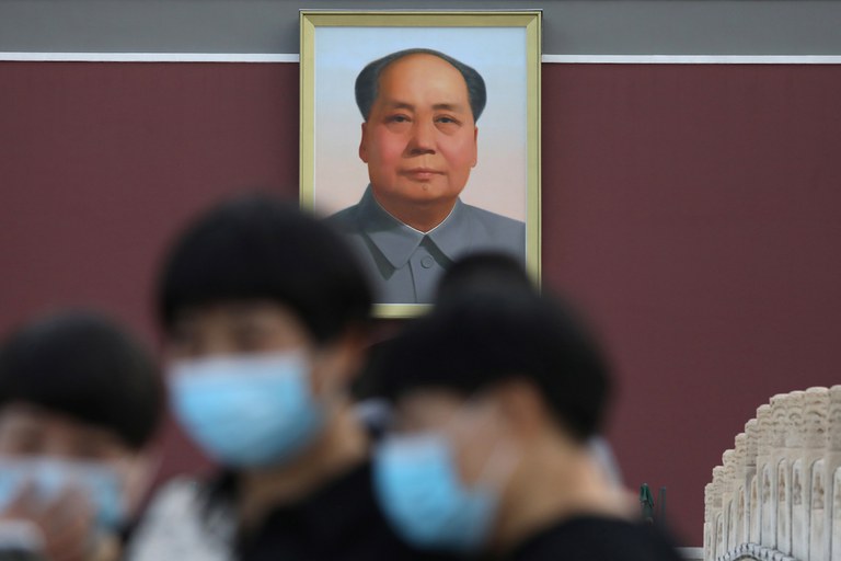 ENG_CHN_AITakedown_10252023.3.JPG Tourists are seen near a portrait of China's late Chairman Mao Zedong at Tiananmen Square, in Beijing, June 16, 2021. Credit: Tingshu Wang/Reuters