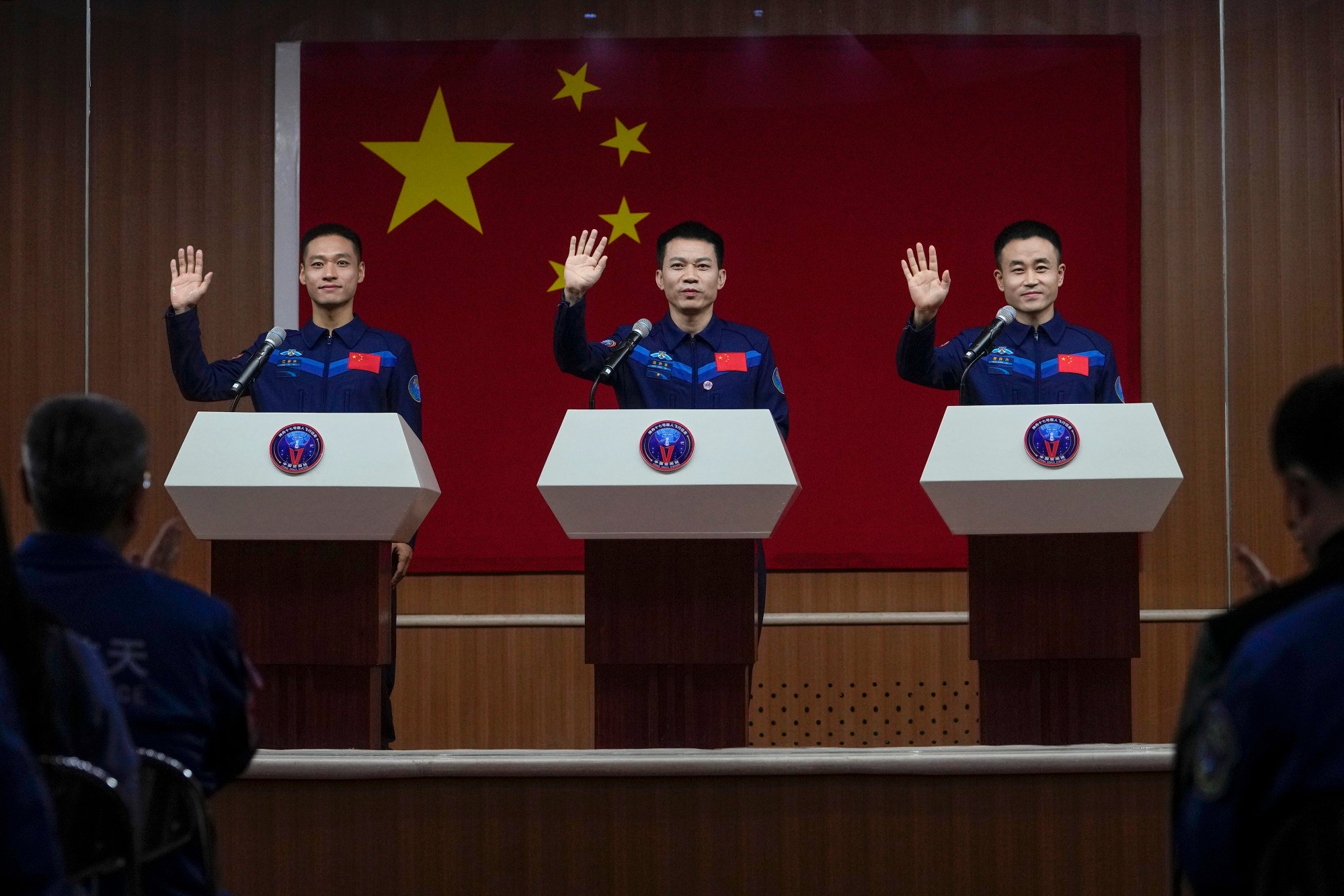 The crew of the Shenzhou 17 mission, (from left) Jiang Xinlin, Tang Hongbo and Tang Shengjie, arrive for a press conference at the Jiuquan Satellite Launch Centre on Wednesday. Photo: AP chinas next tiangong space station residents will be its youngest crew ever 2