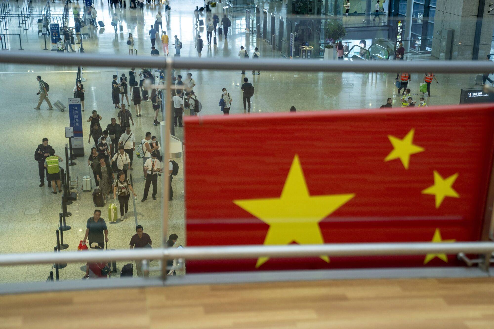 Complicated visa applications and fear of being stopped during a visit to China are keeping foreign tourists and business travellers away. Source: Bloomberg