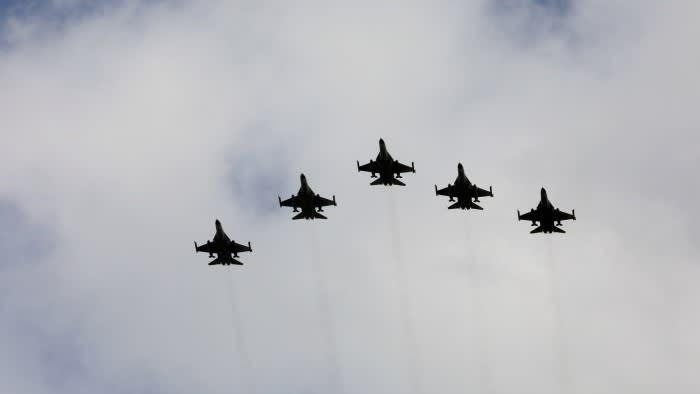 Taiwanese F-16 fighter jets fly in formation during a ceremony in Taichung, Taiwan