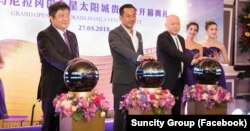 Kuo Che-min and Lin Pin-Wen, second and third from left, attend the launch event of a joint gambling venture in Manila, the Philippines, in 2018. Both men are now on trial in Taiwan on fraud and money laundering charges. (Facebook page of the Suncity Group)
